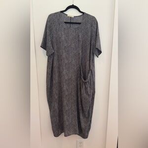 One size comfy midi dress. Pocket on front.